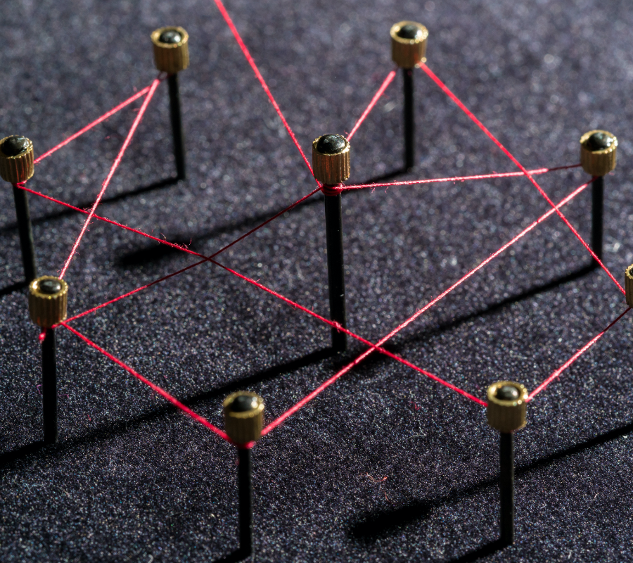 Pins connected by red thread